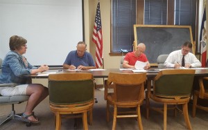Mahaska County Supervisors sign the official results of the June 7 primary election. 